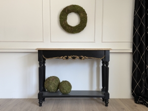 Front view of Aurelia handcrafted console table with shelf, solid oak top, black finish, and hand-applied gold accents.